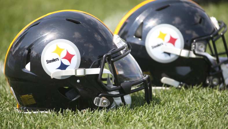 Pittsburgh Steelers helmets on the field during training camp.