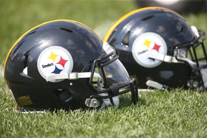 Pittsburgh Steelers helmets on the field during training camp.