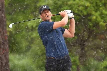 Tom Brady takes a shot during The Match