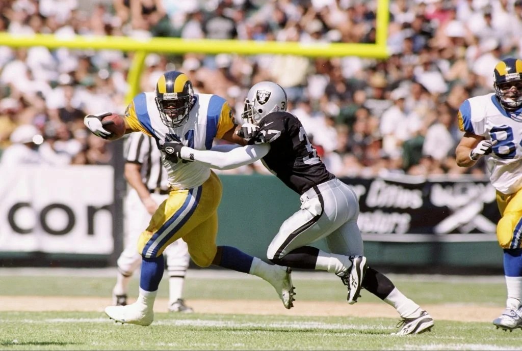 Rams running back Lawrence Phillips tackled against Raiders
