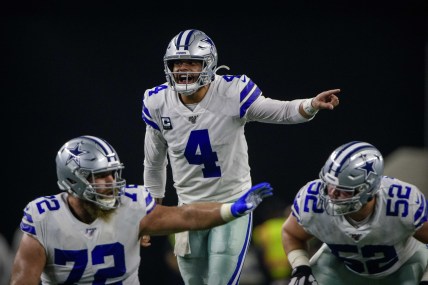 Dak Prescott calls a play at the line