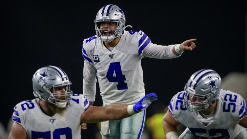 Dak Prescott calls a play at the line