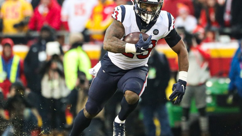 Carlos Hyde runs the ball against the Chiefs in an NFL Playoff game.