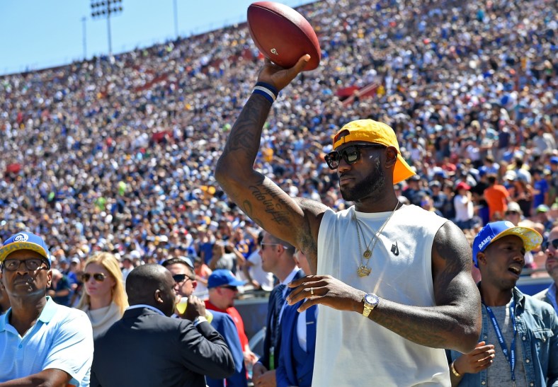 LeBron James throws football before NFL game