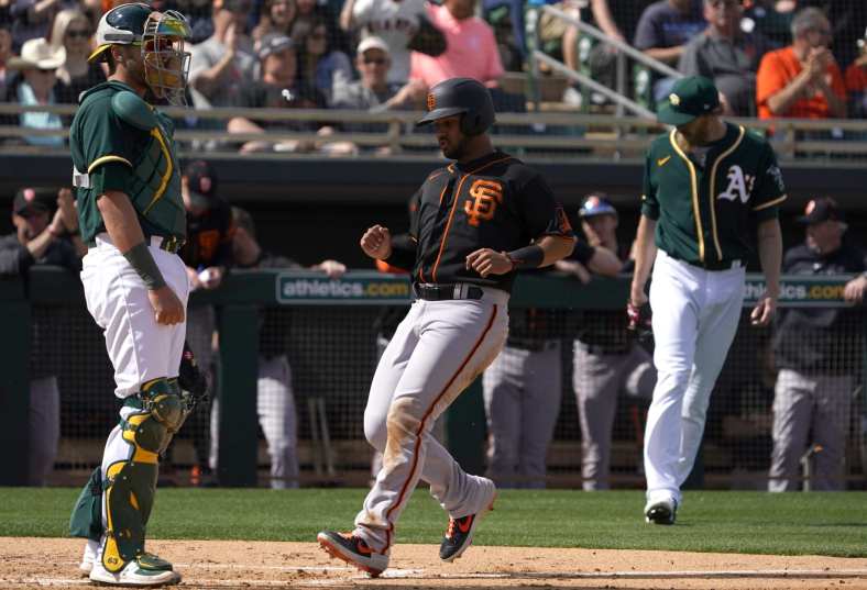 The Athletics and Giants take part in a Spring Training game.