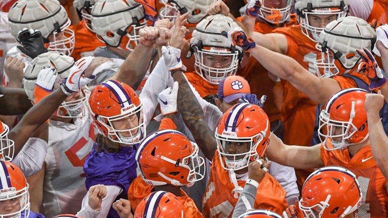 Clemson Tigers football players huddle