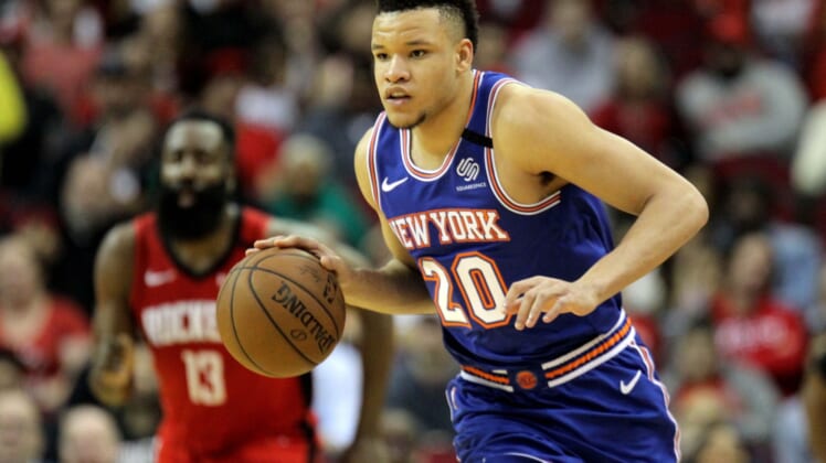 Knicks forward Kevin Knox dribbles the ball against the Rockets.