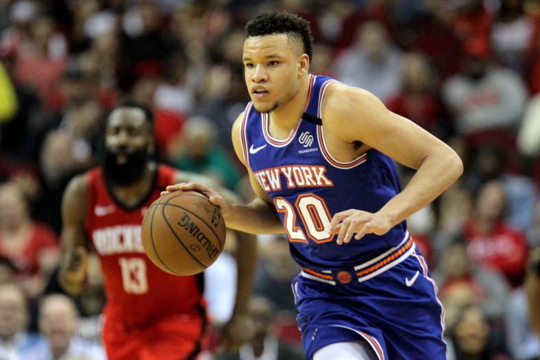 Knicks forward Kevin Knox dribbles the ball against the Rockets.