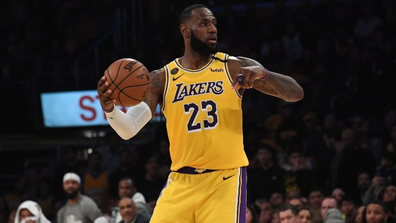 Los Angeles Lakers star LeBron James passes the ball against the Brooklyn Nets.