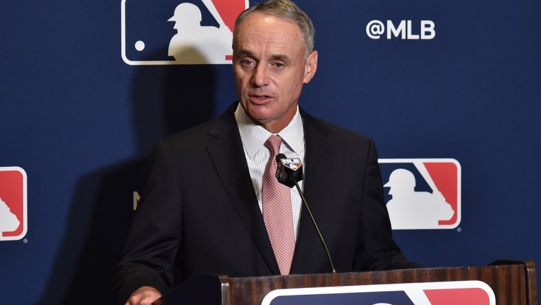 MLB commissioner Rob Manfred speaks to reporters