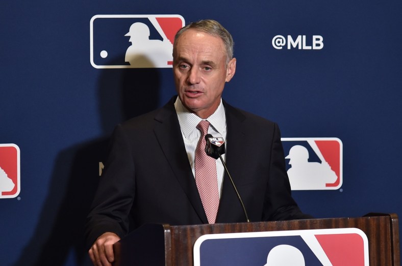 MLB commissioner Rob Manfred speaks to reporters