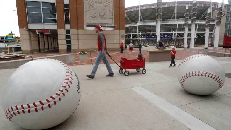 Cincinnati Reds fan walks outside Great American Ballpark on what would have been MLB 2020 opening day.