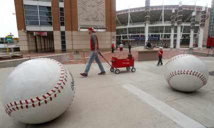 Cincinnati Reds fan walks outside Great American Ballpark on what would have been MLB 2020 opening day.