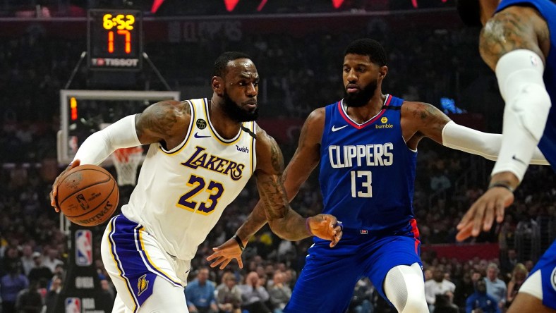 Paul George guards LeBron James