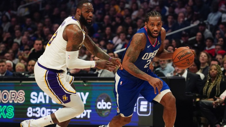 LeBron James guards Kawhi Leonard