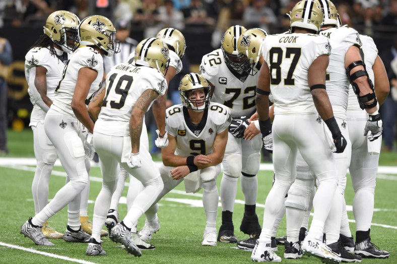 New Orleans Saints quarterback Drew Brees with his teammates