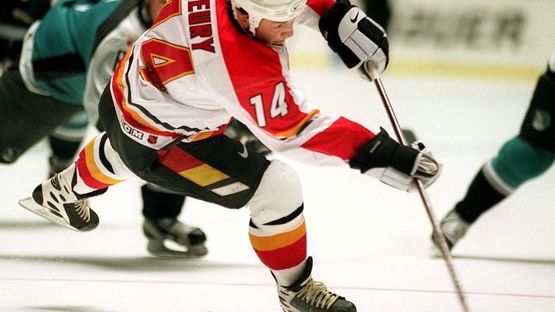 Calgary Flames forward Theoren Fleury shots the pu