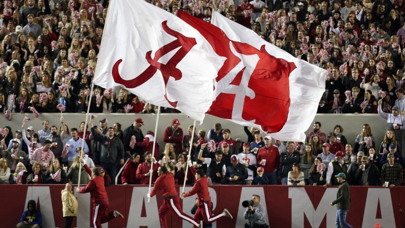 Alabama Crimson Tide flags wave during football game