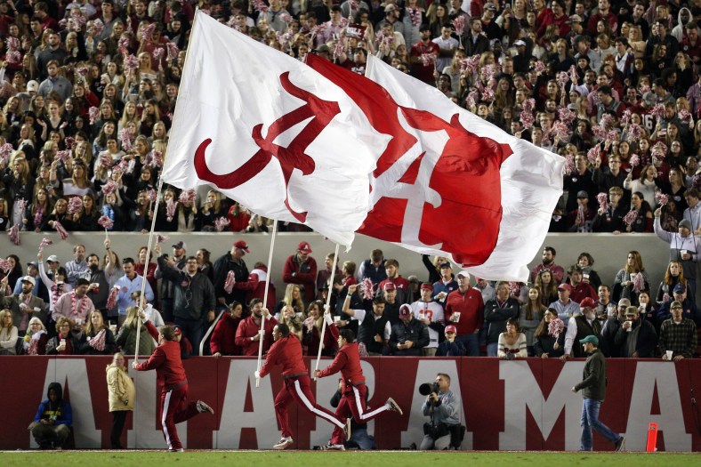 Alabama Crimson Tide flags wave during football game