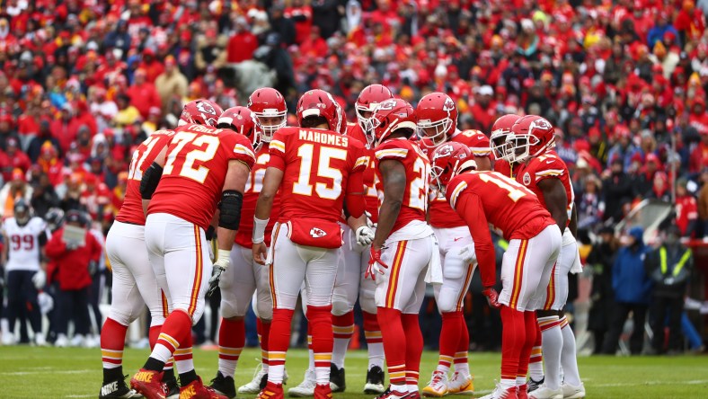 NFL players huddle during game