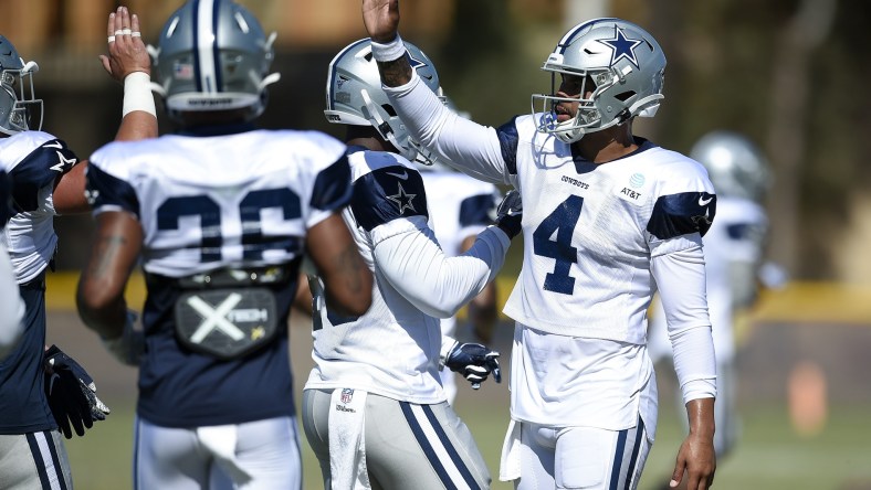 Dallas Cowboys players huddle during training camp