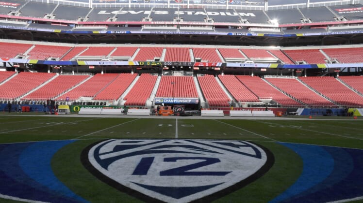 Pac 12 Conference logo on football field