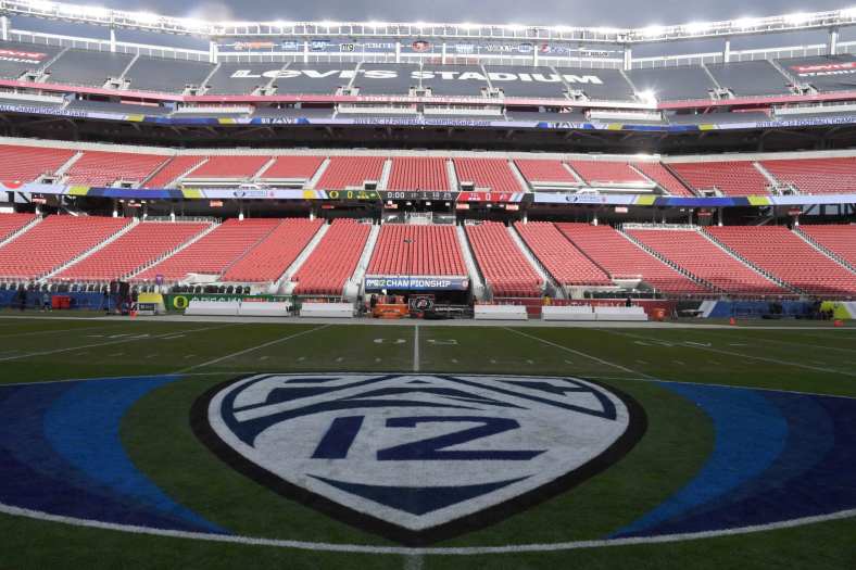 Pac 12 Conference logo on football field