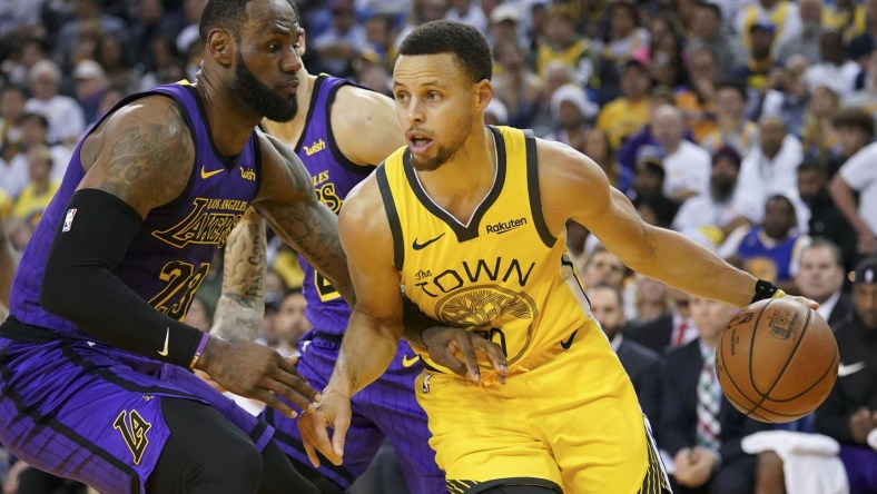 Warriors Stephen Curry goes up against Lakers' LeBron James