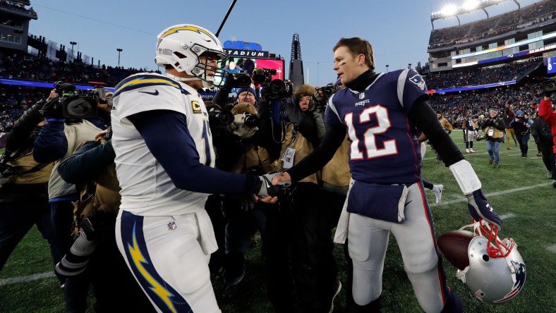 Tom Brady and Philip Rivers shake hands after NFL Playoff game.