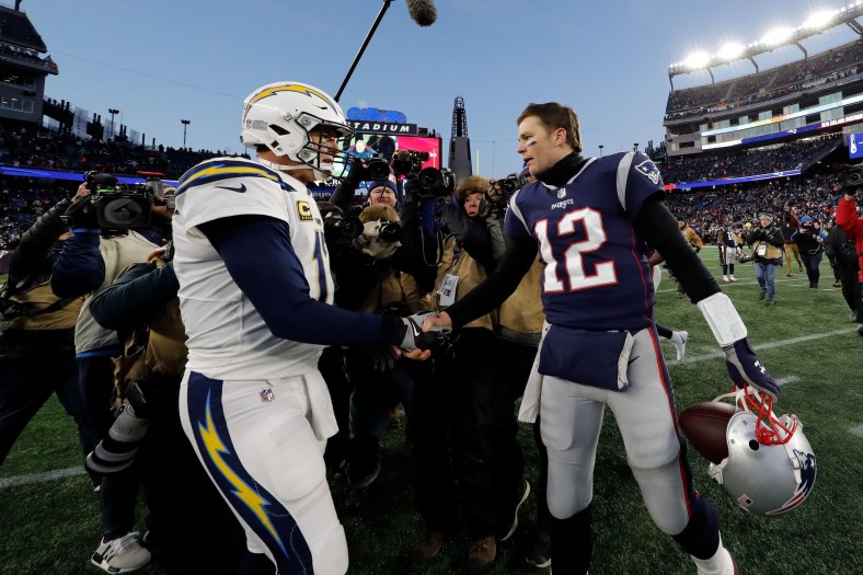Tom Brady and Philip Rivers shake hands after NFL Playoff game.