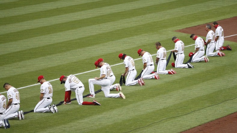 Nationals players kneel before the anthem ahead of opener against Yankees