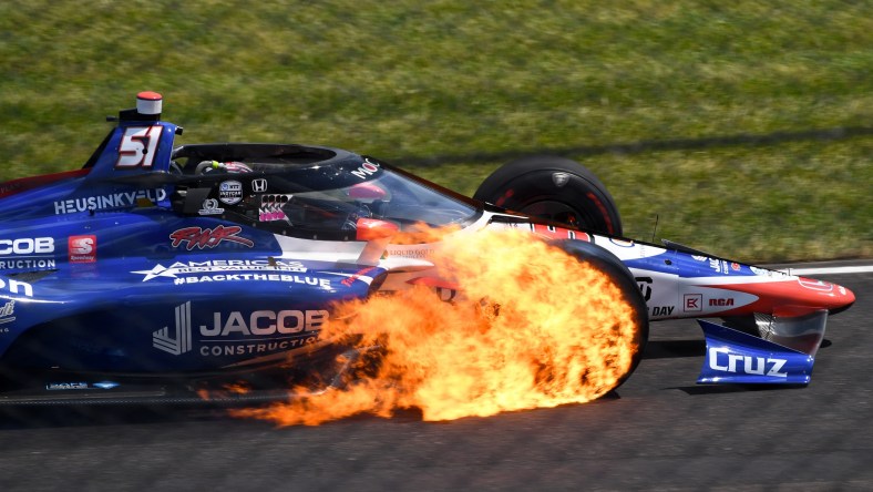 Indy Series driver James Davison 's tire catches fire during Indianapolis 500