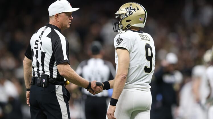 New Orleans Saints QB Drew Brees and an NFL referee