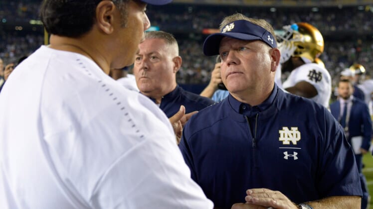 Notre Dame coach Brian Kelly and Navy coach Ken Niumatalolo