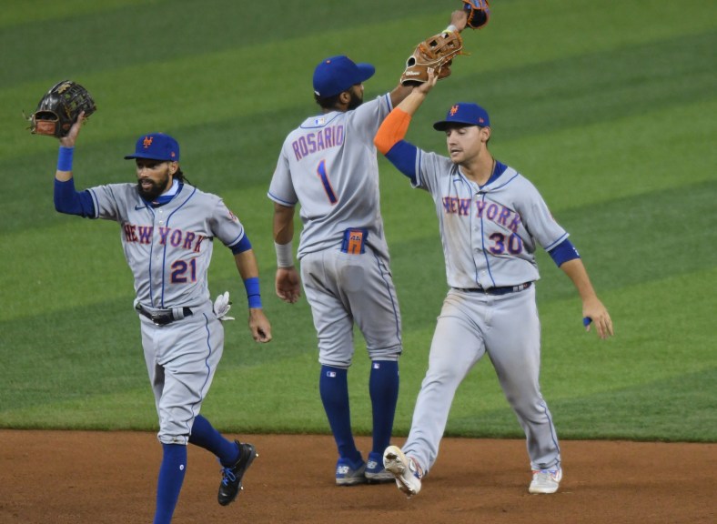 New York Mets players celebrate after a win
