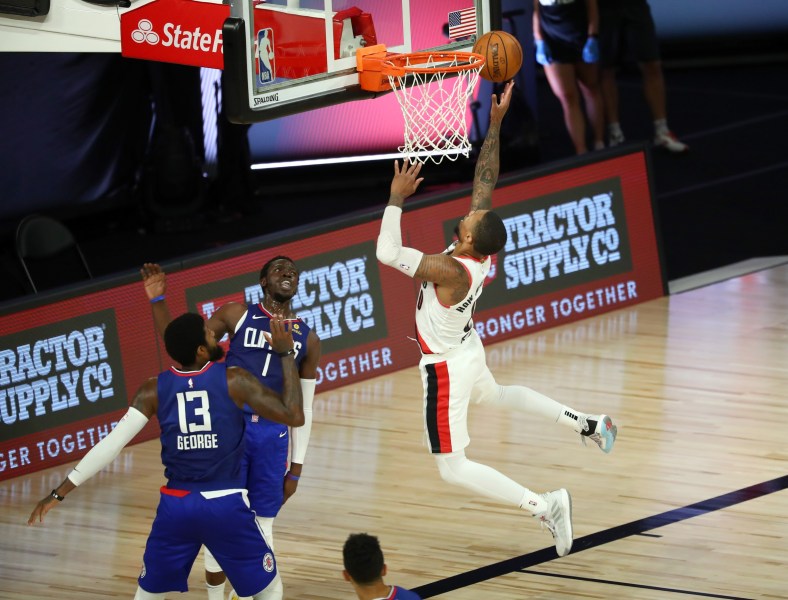 Blazers' Damian Lillard against Paul George of the Clippers
