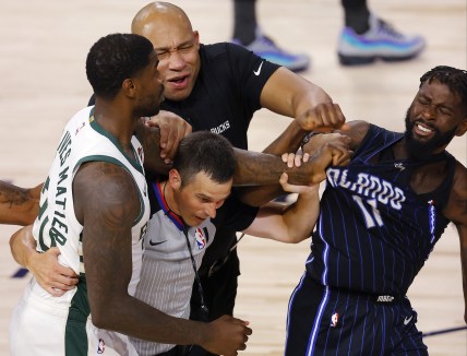 Magic James Ennis and Bucks Marvin Williams fight during NBA game