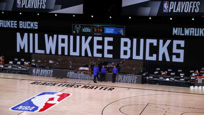 Aug 26, 2020; Lake Buena Vista, Florida, USA; Referees stand on an empty court before the start of a scheduled game between the Milwaukee Bucks and the Orlando Magic for Game Five of the Eastern Conference First Round during the 2020 NBA Playoffs at AdventHealth Arena at ESPN Wide World Of Sports Complex on August 26, 2020 in Lake Buena Vista, Florida. Mandatory Credit: Kevin C. Cox/Pool Photo-USA TODAY Sports