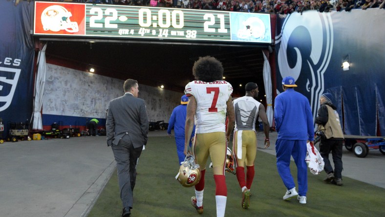 NFL quarterback Colin Kaepernick walks off the field