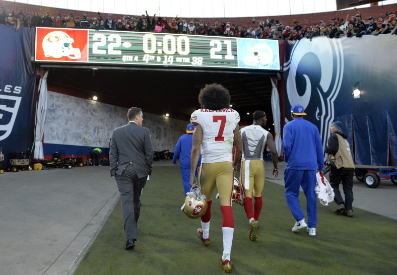 NFL quarterback Colin Kaepernick walks off the field