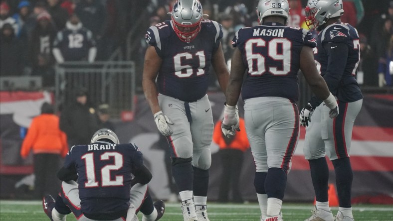 New England Patriots players and QB Tom Brady