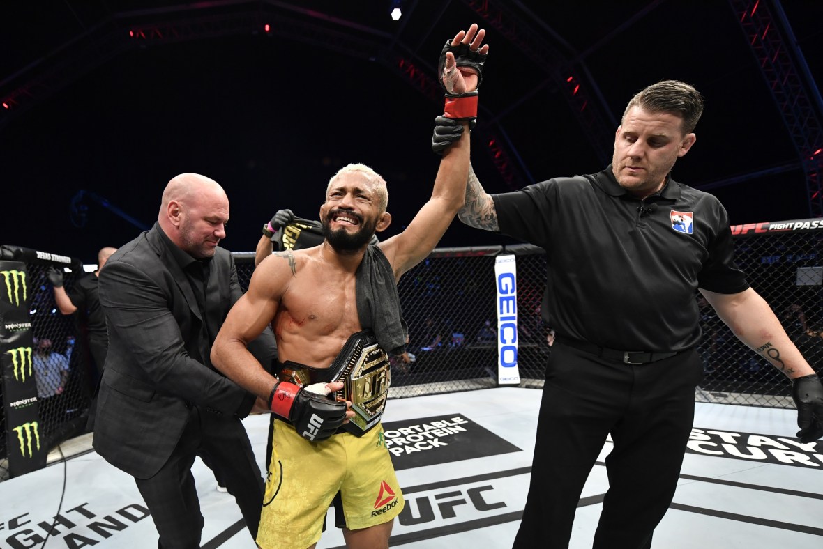 July 19, 2020; Abu Dhabi, UAE; Deiveson Figueiredo of Brazil celebrates after defeating Joseph Benavidez in their UFC flyweight championship bout during UFC Fight Night at the Flash Forum on UFC Fight Island. Mandatory Credit: Jeff Bottari/Zuffa LLC via USA TODAY Sports