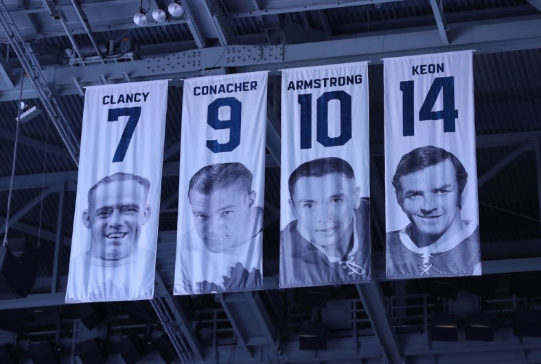 Nov 25, 2017; Toronto, Ontario, CAN; The honored numbers of former Toronto Maple Leafs players King Clancy (7) and Charlie Conacher (9) and George Armstrong (10) and Dave Keon (14) hang from the rafters before the start of the game against the Washington Capitals at Air Canada Centre. The Capitals beat the Maple Leafs 4-2. Mandatory Credit: Tom Szczerbowski-USA TODAY Sports