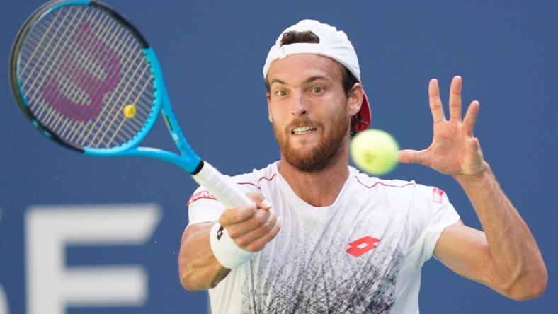 Sept 3, 2018; New York, NY, USA;  
Joao Sousa of Portugal hits to Novak Djokovic of Serbia in a fourth round match on day eight of the 2018 U.S. Open tennis tournament at USTA Billie Jean King National Tennis Center. Mandatory Credit: Robert Deutsch-USA TODAY Sports