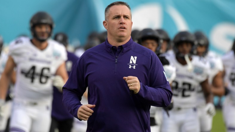 Dec 31, 2018; San Diego, CA, United States; Northwestern Wildcats head coach Pat Fitzgerald runs onto the field during the 2018 Holiday Bowl against the Utah Utes at SDCCU Stadium. Mandatory Credit: Kirby Lee-USA TODAY Sports