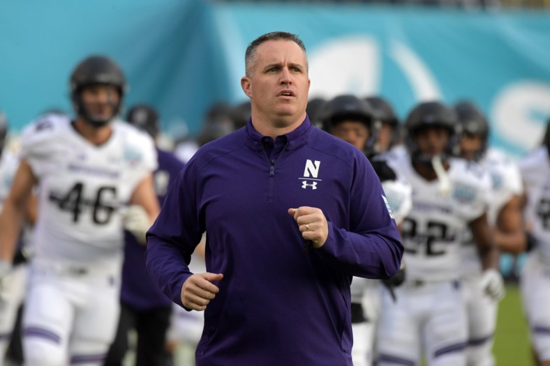 Dec 31, 2018; San Diego, CA, United States; Northwestern Wildcats head coach Pat Fitzgerald runs onto the field during the 2018 Holiday Bowl against the Utah Utes at SDCCU Stadium. Mandatory Credit: Kirby Lee-USA TODAY Sports