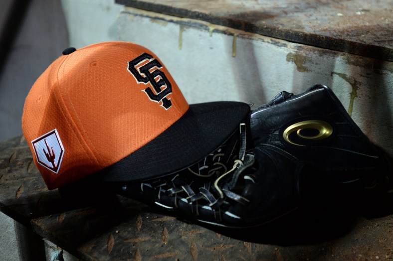 Mar 7, 2019; Scottsdale, AZ, USA; A detailed view of a San Francisco Giants spring training baseball cap in the dugout during the game against the Oakland Athletics at Scottsdale Stadium. Mandatory Credit: Orlando Ramirez-USA TODAY Sports