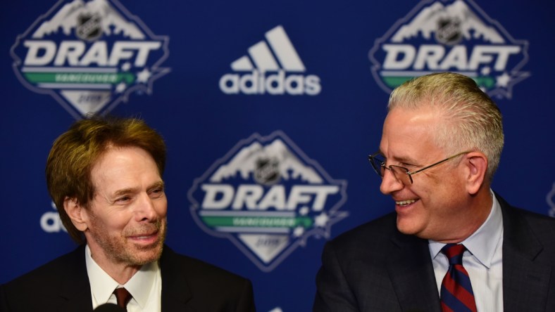 Jun 21, 2019; Vancouver, BC, Canada; NHL Seattle owner Jerry Bruckheimer (left) and NHL Seattle president Tod Leiweke speak at a press conference before the first round of the 2019 NHL Draft at Rogers Arena. Mandatory Credit: Anne-Marie Sorvin-USA TODAY Sports