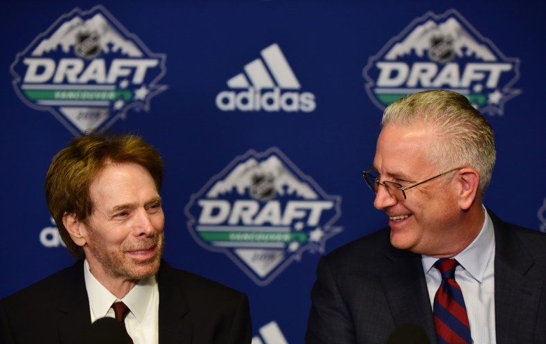 Jun 21, 2019; Vancouver, BC, Canada; NHL Seattle owner Jerry Bruckheimer (left) and NHL Seattle president Tod Leiweke speak at a press conference before the first round of the 2019 NHL Draft at Rogers Arena. Mandatory Credit: Anne-Marie Sorvin-USA TODAY Sports
