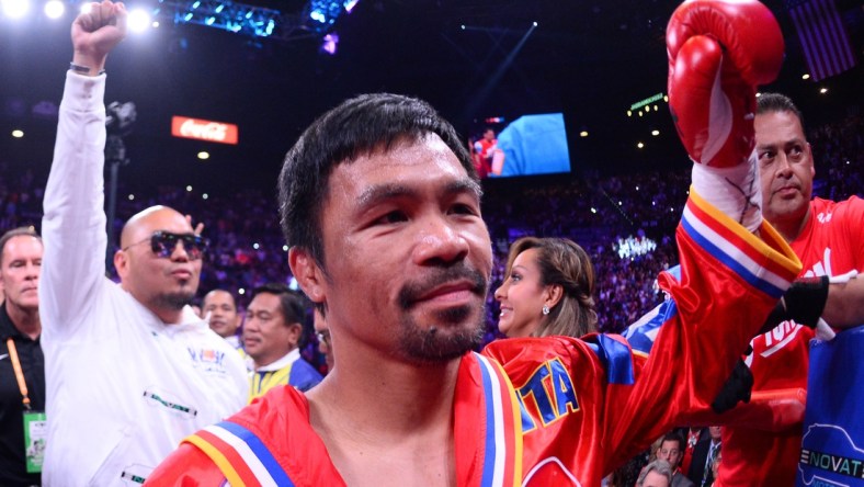 Jul 20, 2019; Las Vegas, NV, USA; Manny Pacquiao enters the ring to face Keith Thurman (not pictured) for their WBA welterweight championship bout at MGM Grand Garden Arena. Pacquiao won via split decision. Mandatory Credit: Joe Camporeale-USA TODAY Sports